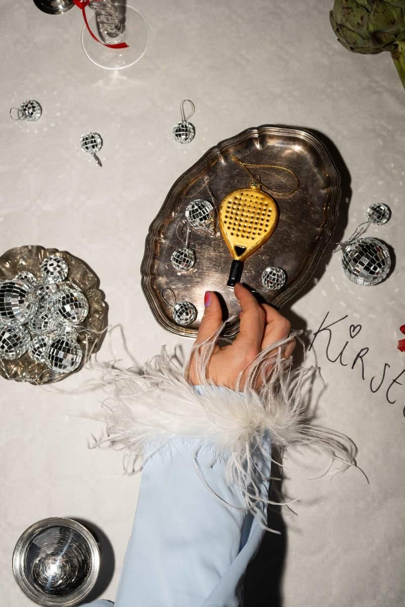 Padelracket Goud Yup in de boom